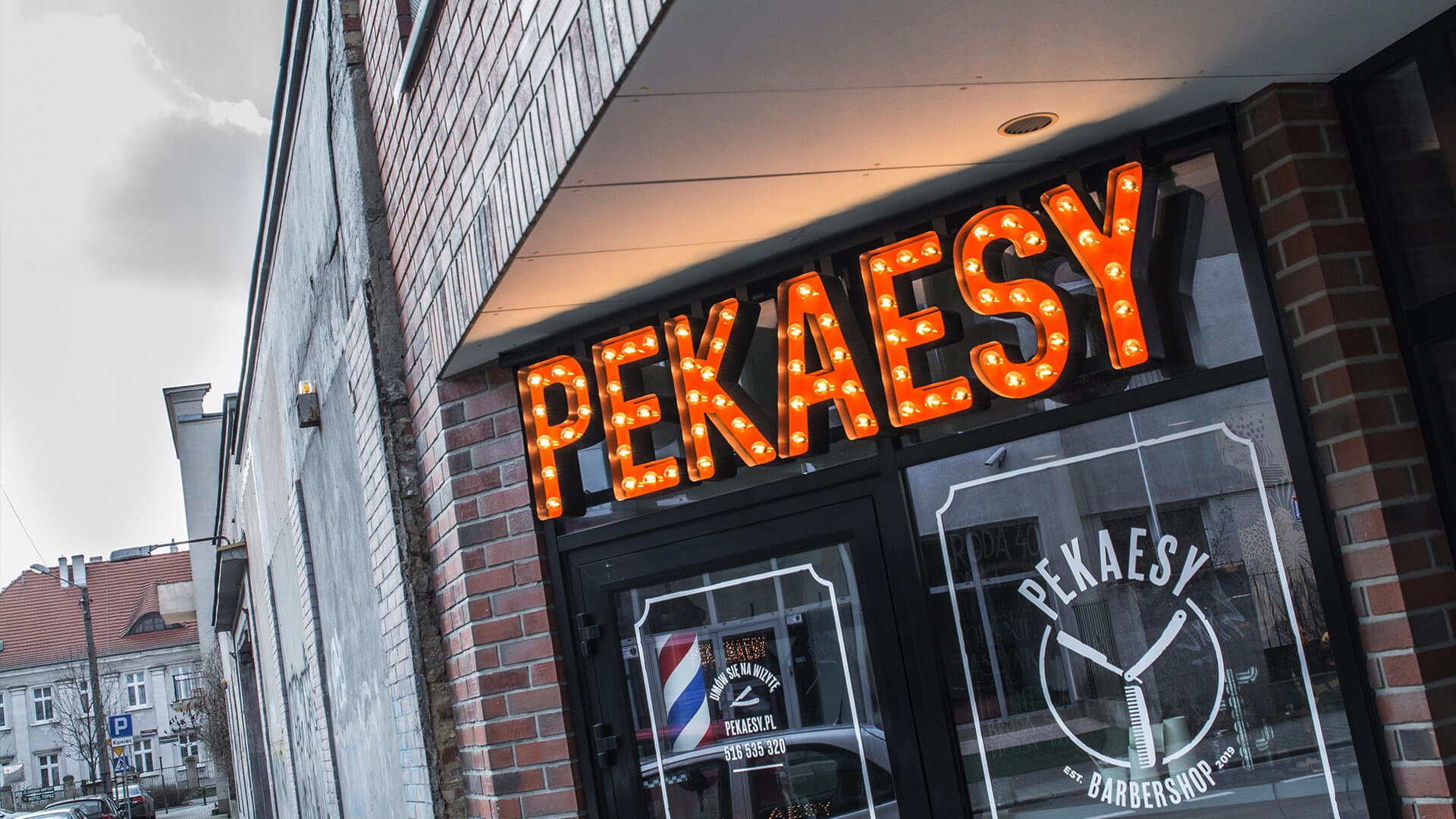 pekaesy hair salon barber shop - pekaesy-liters-with-lights-over-the-entry-to-barbera-liters-coloured-on-height-mounted-to-the-panel-on-the-window-logo-firm-liters-spatial-3d-poznan